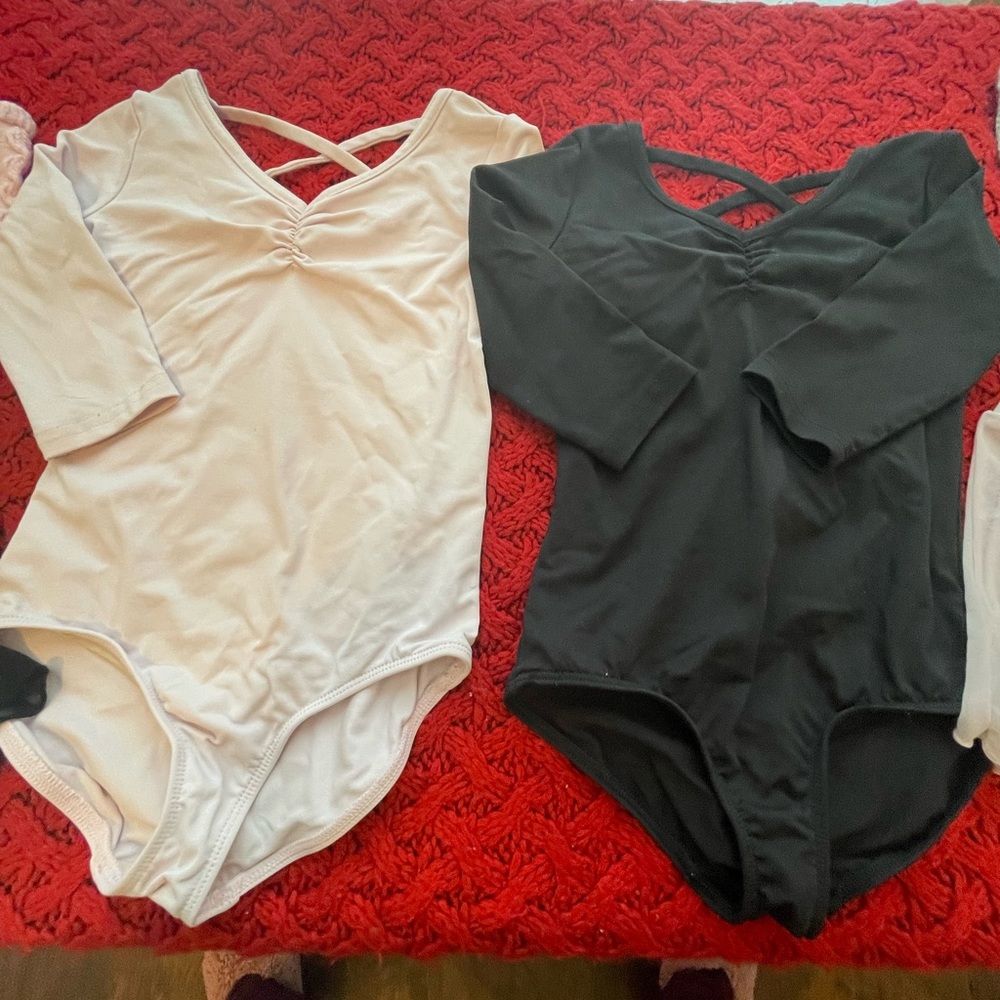 (Set) Danskin dance leotards with mid length sleeves.